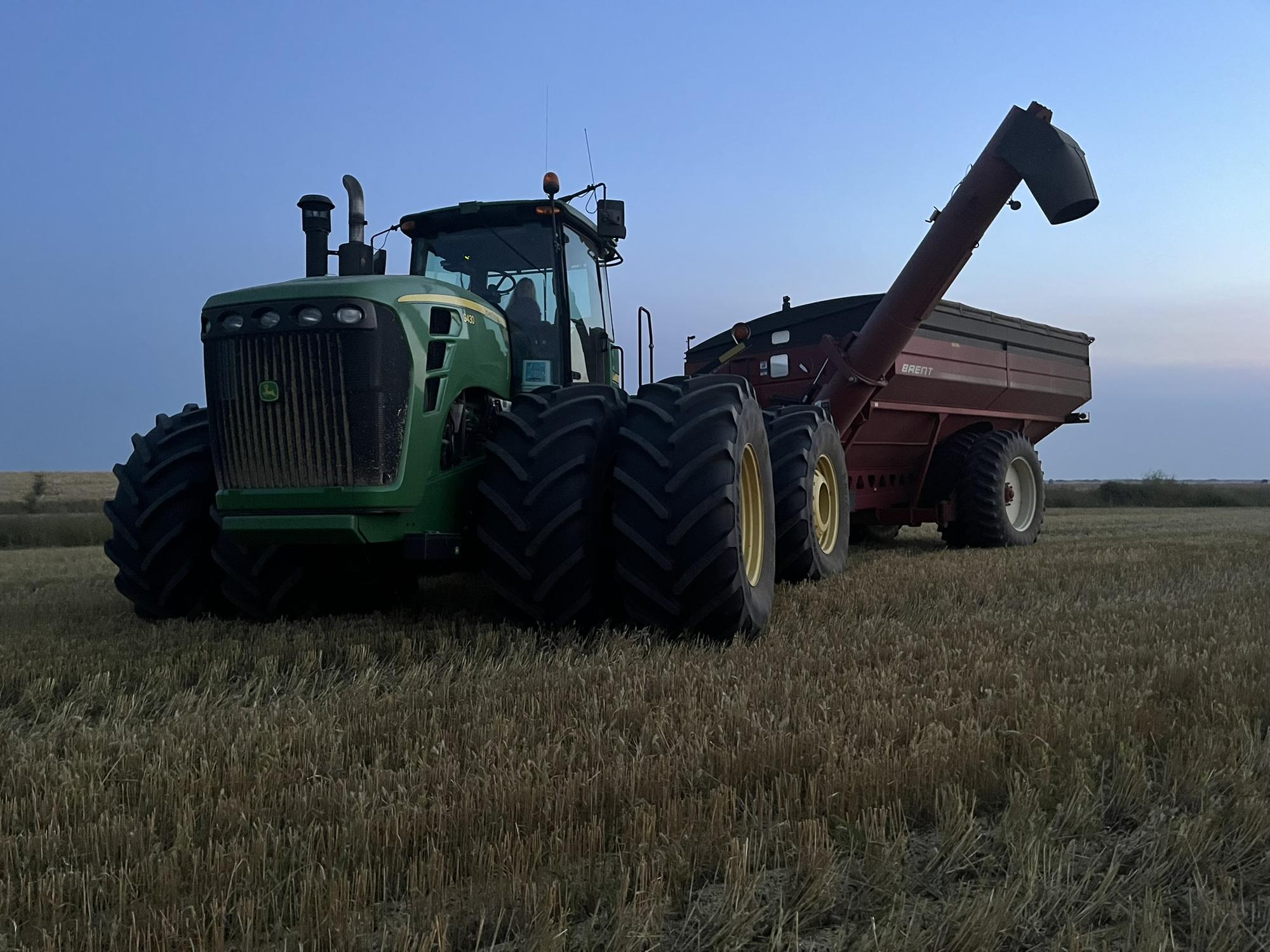 John Deere grain cart at dusk